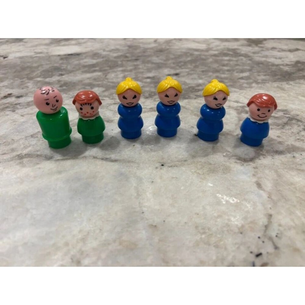 vintage Fisher-Price Little People peg figures from the classic toy era of the 1